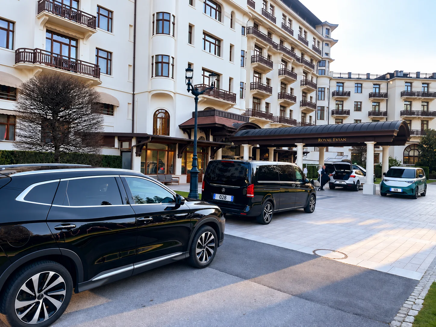 BYD Seal U Hybrid SUV and Mercedes V-Class van outside Hôtel Royal Évian in Évian-les-Bains.